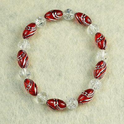Гривна на ластик с червени гравирани цилиндри PICTURE OF ITEM 1361